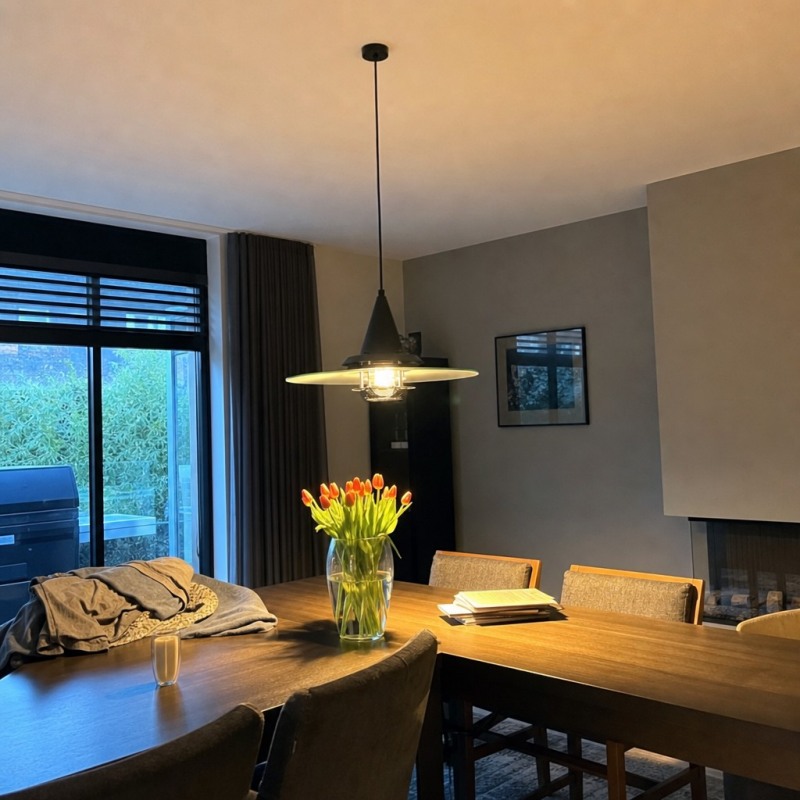 Customer photo of a black Moxellan pendant light over a table