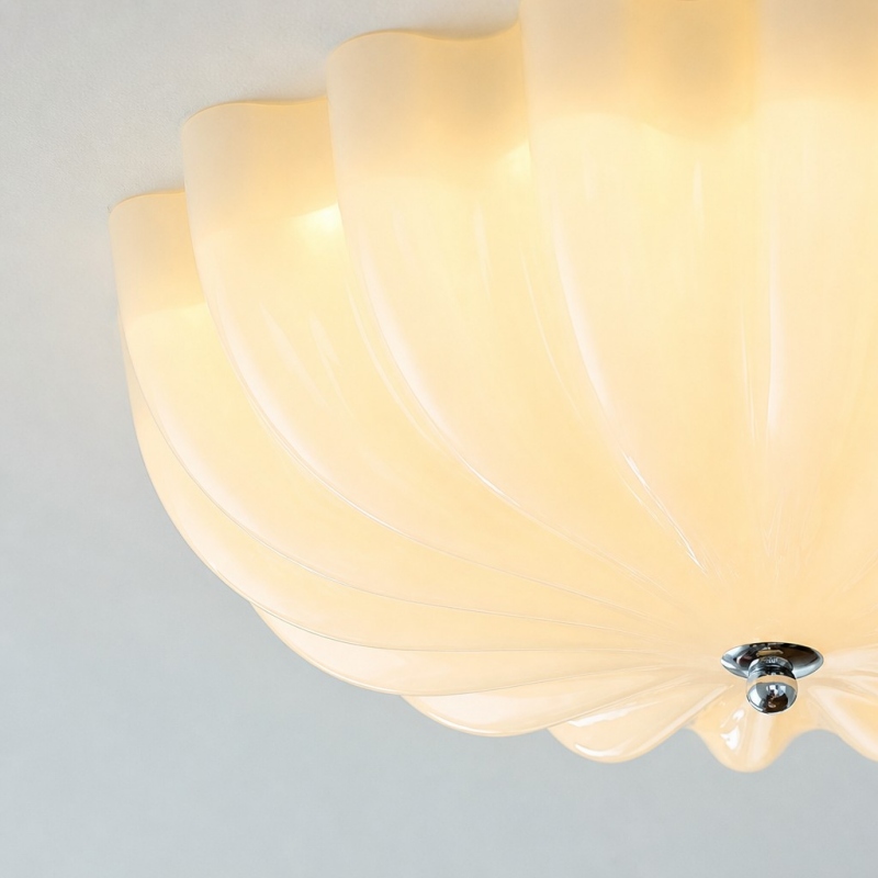 Close-up of the illuminated cream glass shade