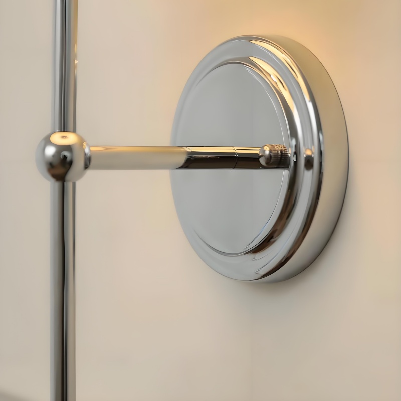 Chrome wall mount detail of the Cumoris lamp