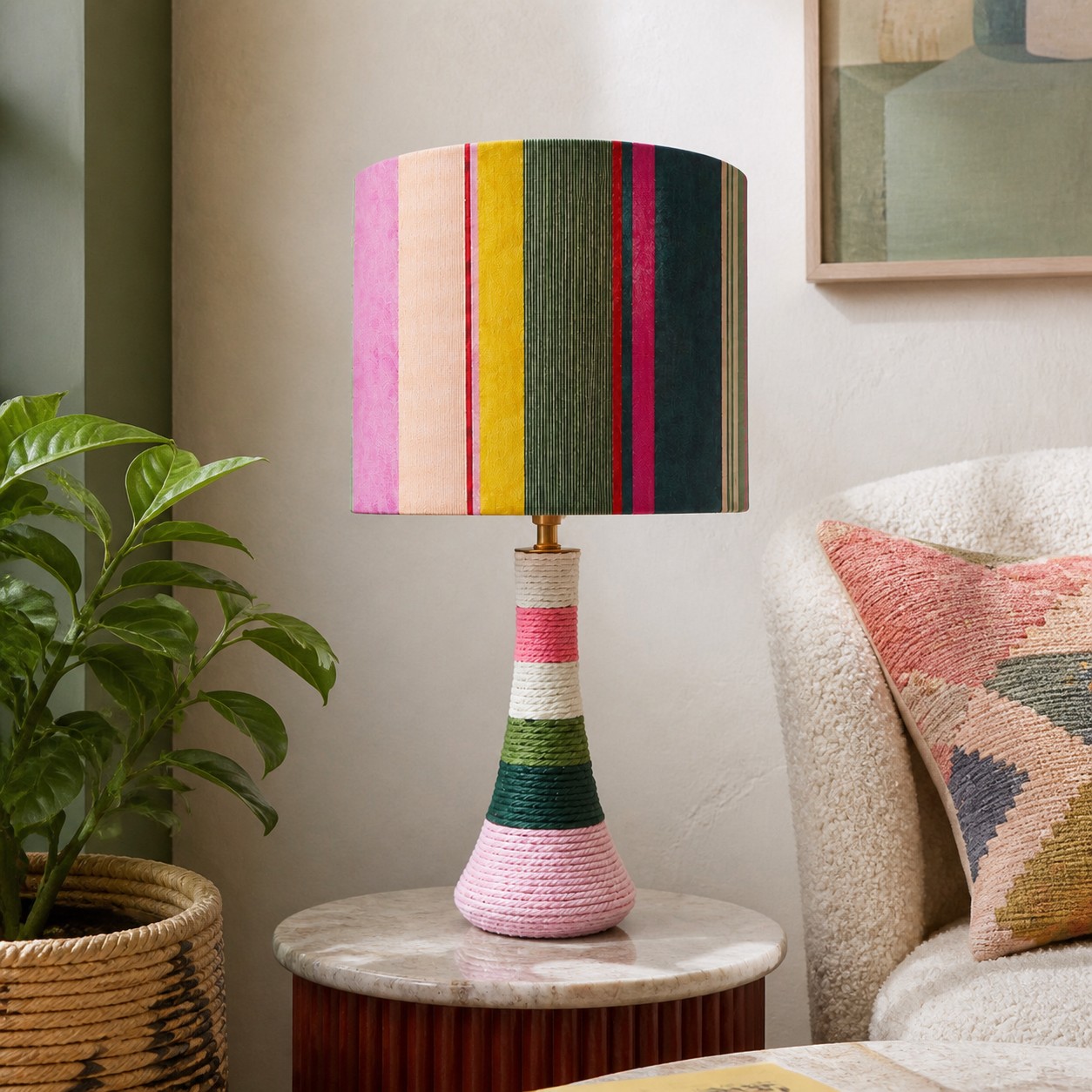 Colorful striped fabric table lamp styled beside a sofa