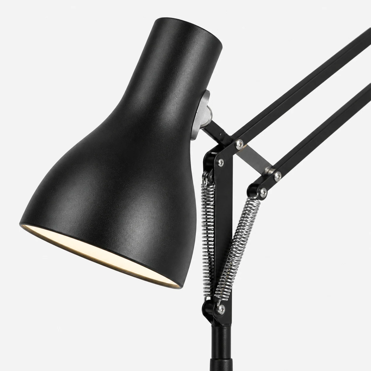Close-up of the Modryx desk lamp metal arm and shade detail
